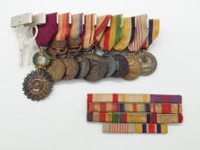 【古美術買取】旧日本軍　9勲章 (11連吊りホルダー付き)&11連略綬セット(従軍記章、連結金具、太陽勲章/大禮(大礼)記念章/功労章/紀元二千六百年祝典記念章/蒙古総合自治政府肇建功労章など)(アンティーク)を買取りました。